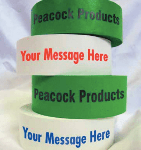 Three rolls of peacock products tape stacked on top of each other