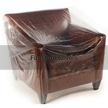 A brown leather chair with a clear plastic cover on it.