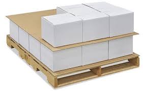A wooden pallet filled with white boxes stacked on top of each other.