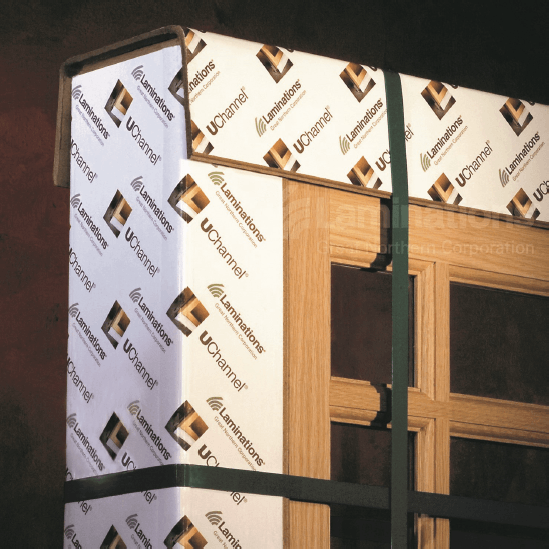 A corner of a wooden door with uc wrap on it