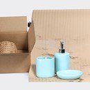 A soap dispenser , toothbrush holder , and soap dish are in a box.