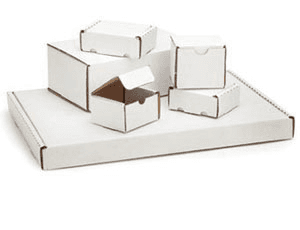 A group of white cardboard boxes are stacked on top of each other.
