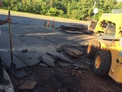 Pot Hole On Asphalt Road — Glastonbury, CT — American USA Paving