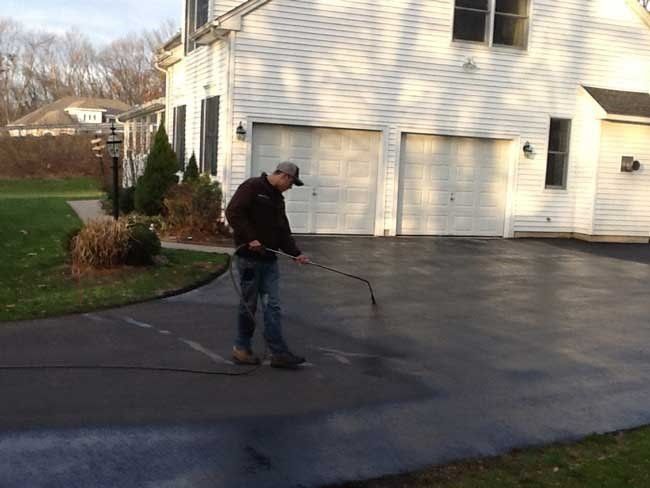 Man In Front Of House — Glastonbury, CT — American USA Paving