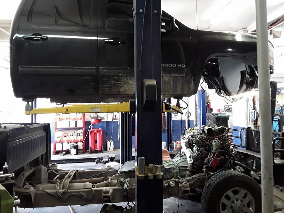 Vehicle Lifted For Underbody Repair | Ric Henry Auto Service