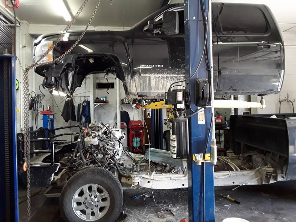 Technicians Performing Engine Service | Ric Henry Auto Service