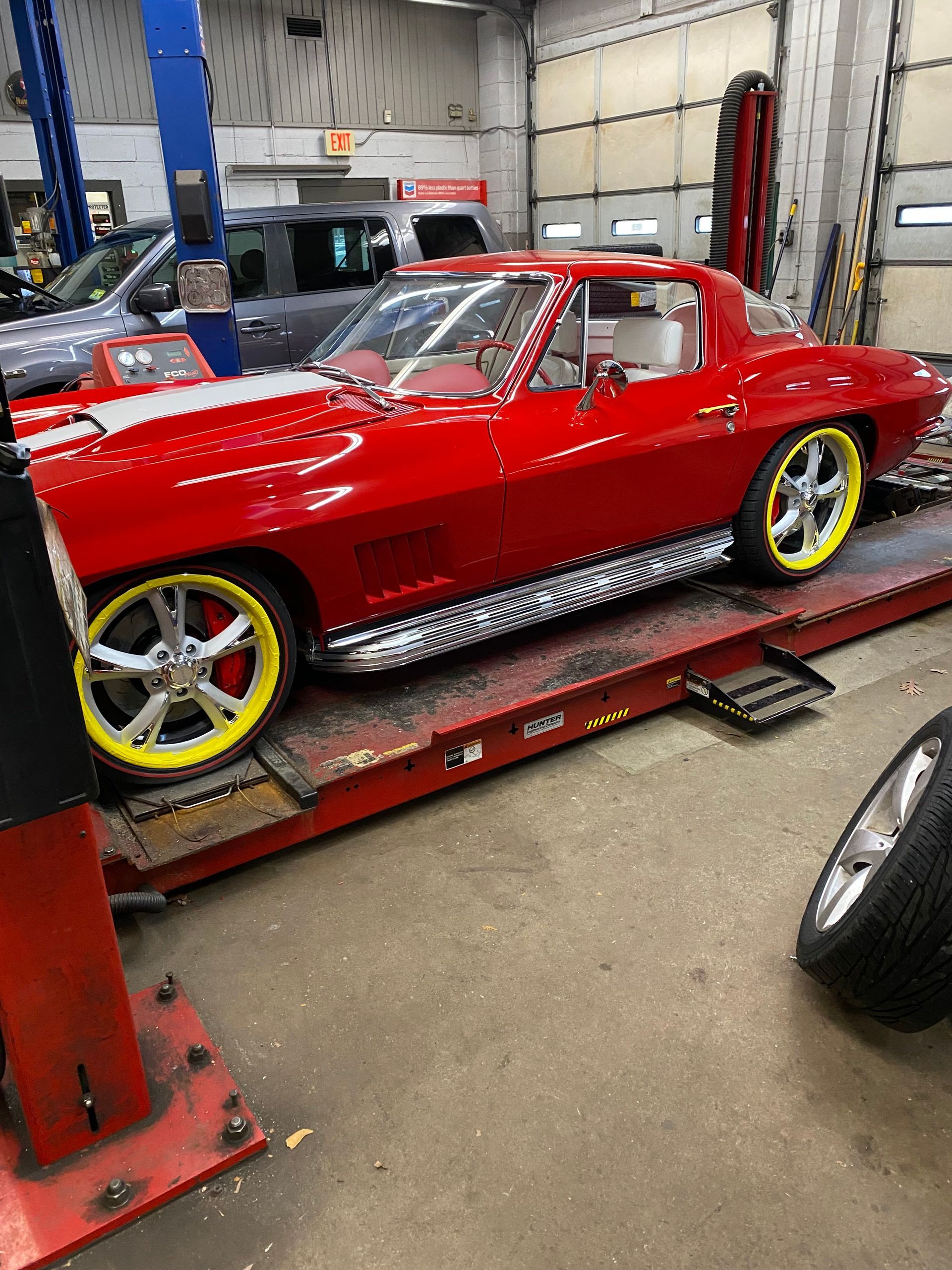 red car with yellow rims | Red Lion Express Lube And Auto Repair