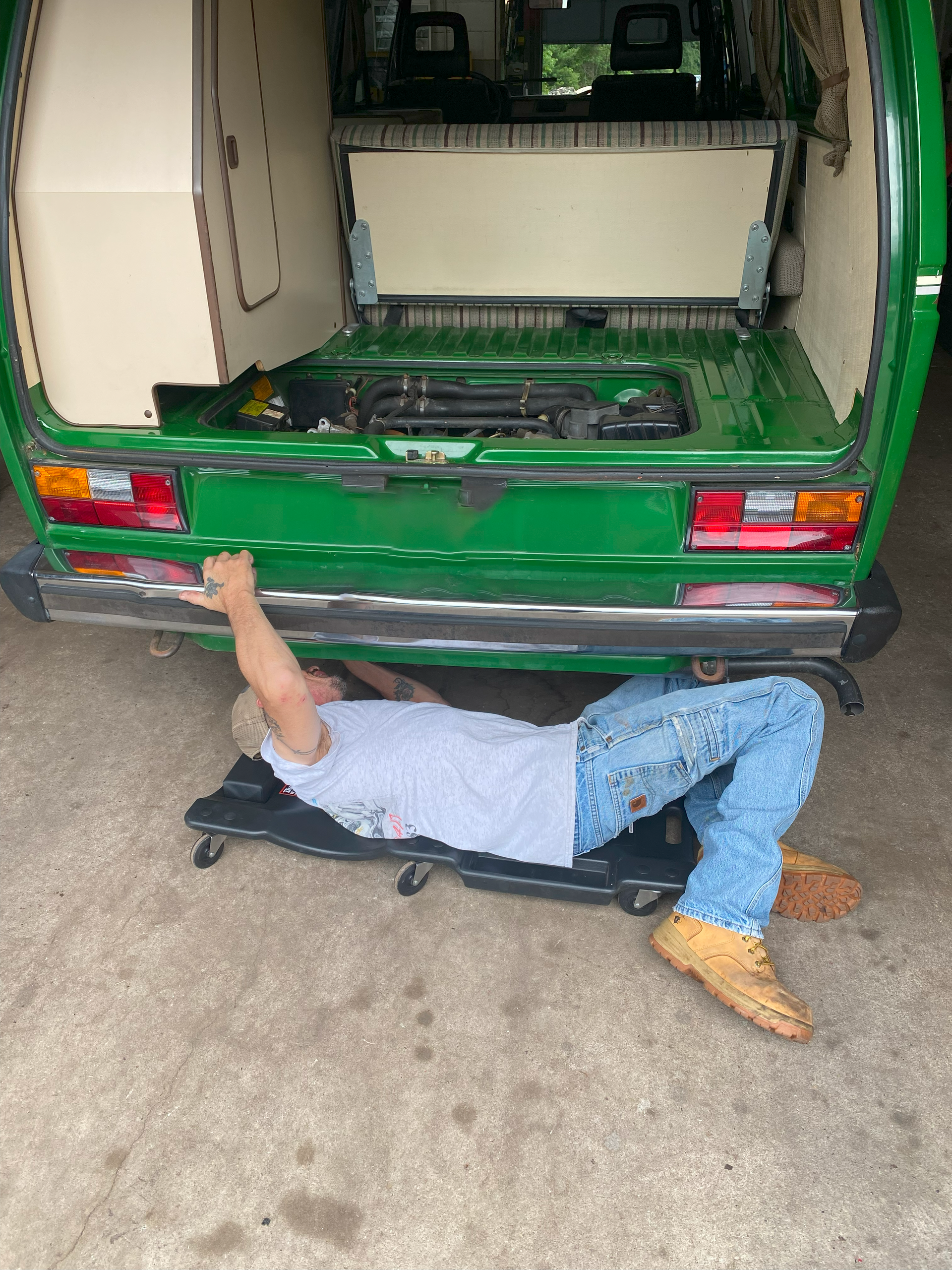 mechanic working on red car | Red Lion Express Lube And Auto Repair