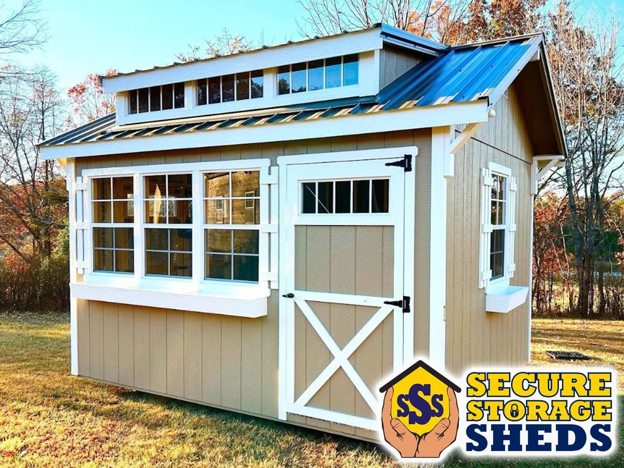 A shed with a blue roof and a sign that says secure storage sheds