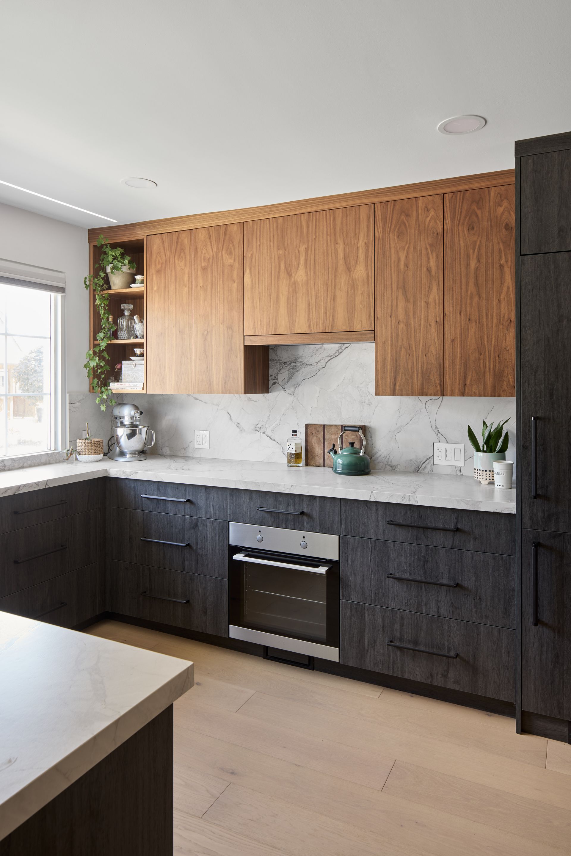 A kitchen with wooden cabinets and stainless steel appliances.