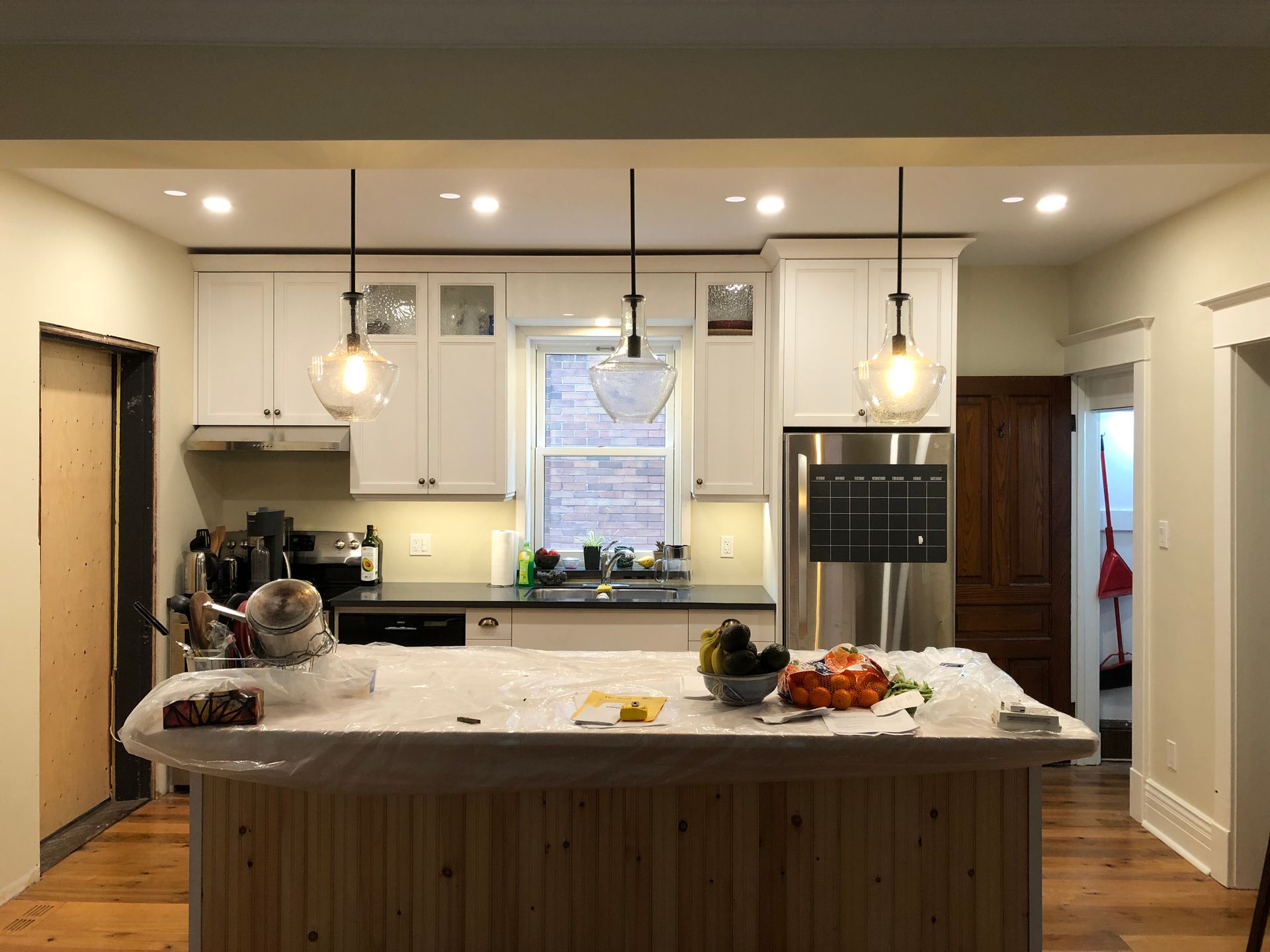 A kitchen with a large island in the middle of it.
