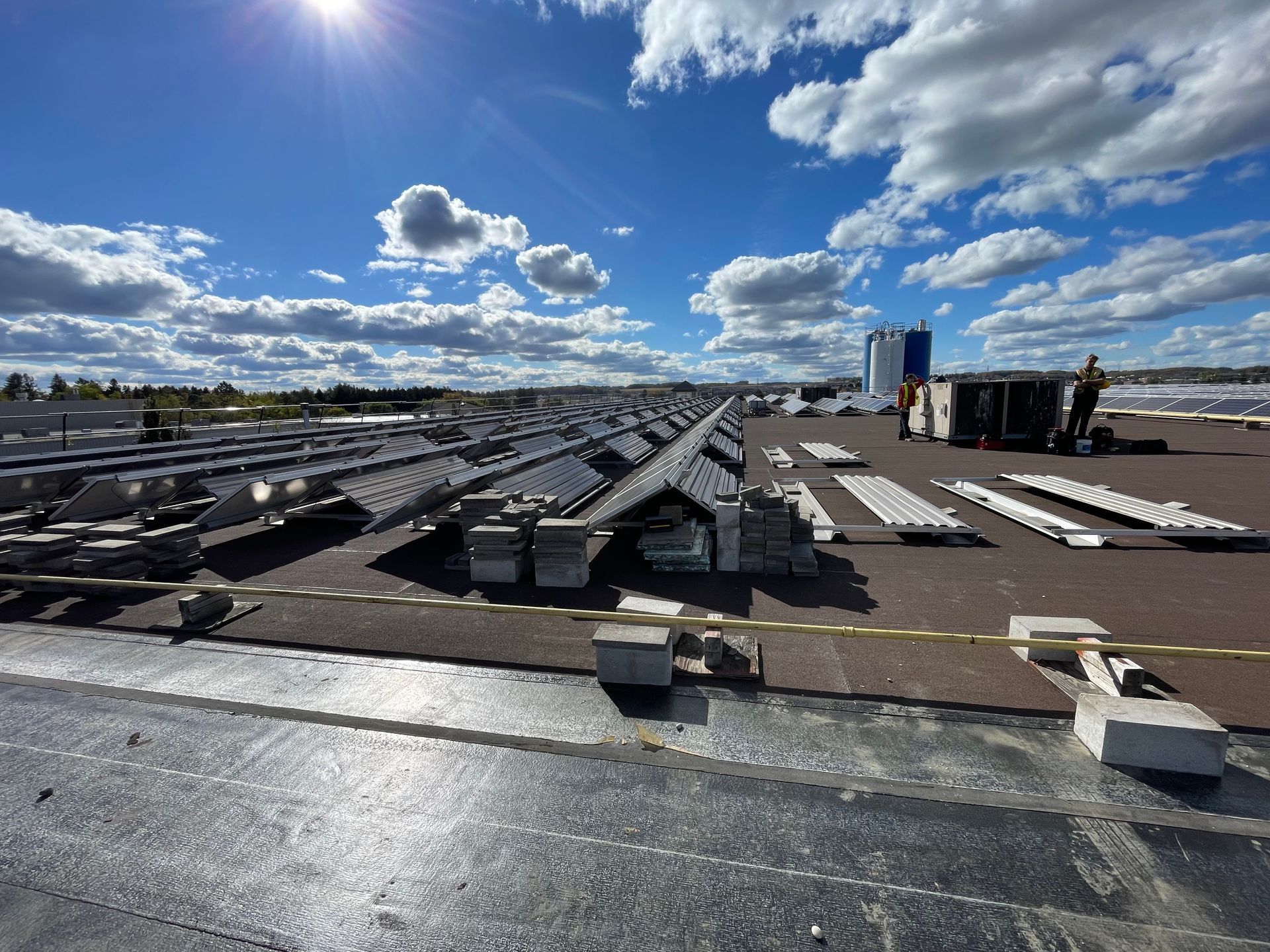 A large roof with a lot of roofing materials on it.