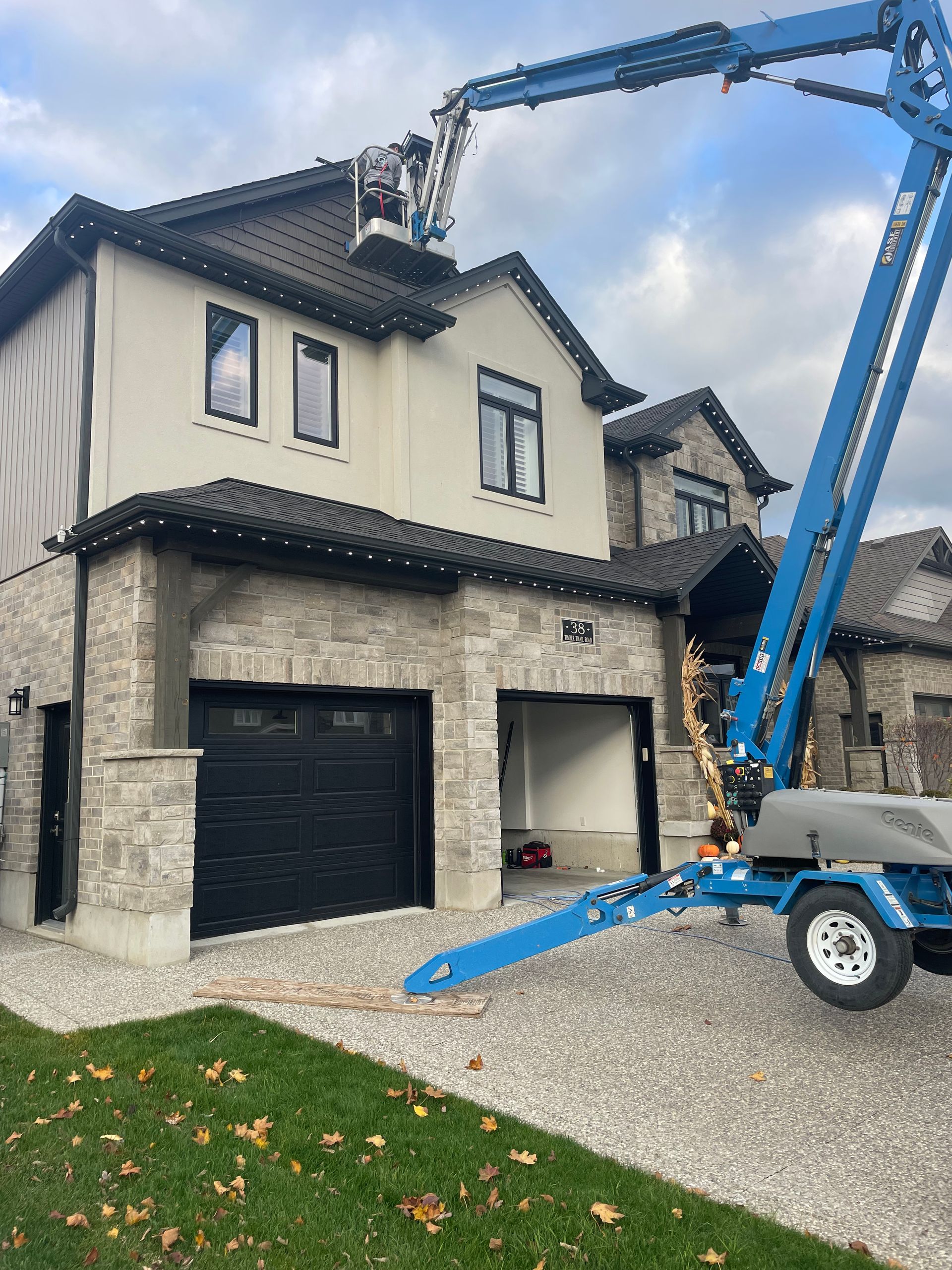 A large house with a crane on the side of it.