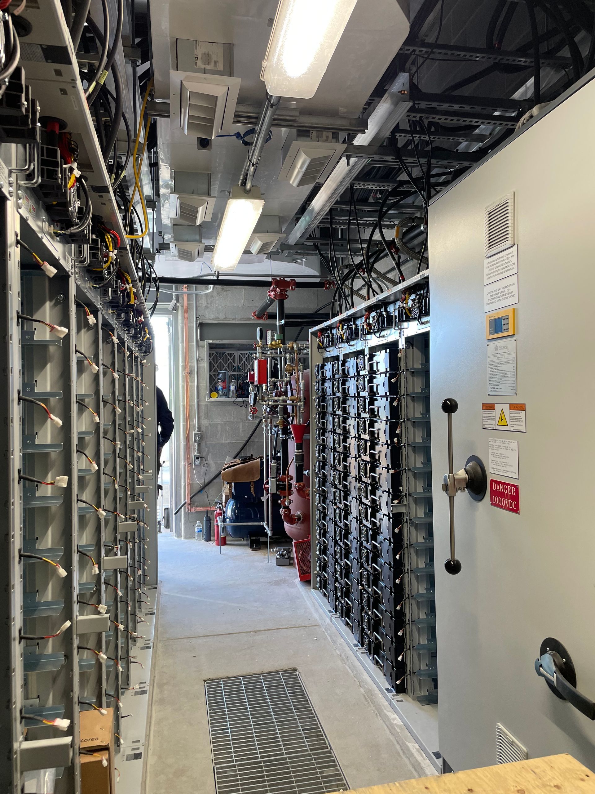 A long hallway filled with lots of electrical equipment