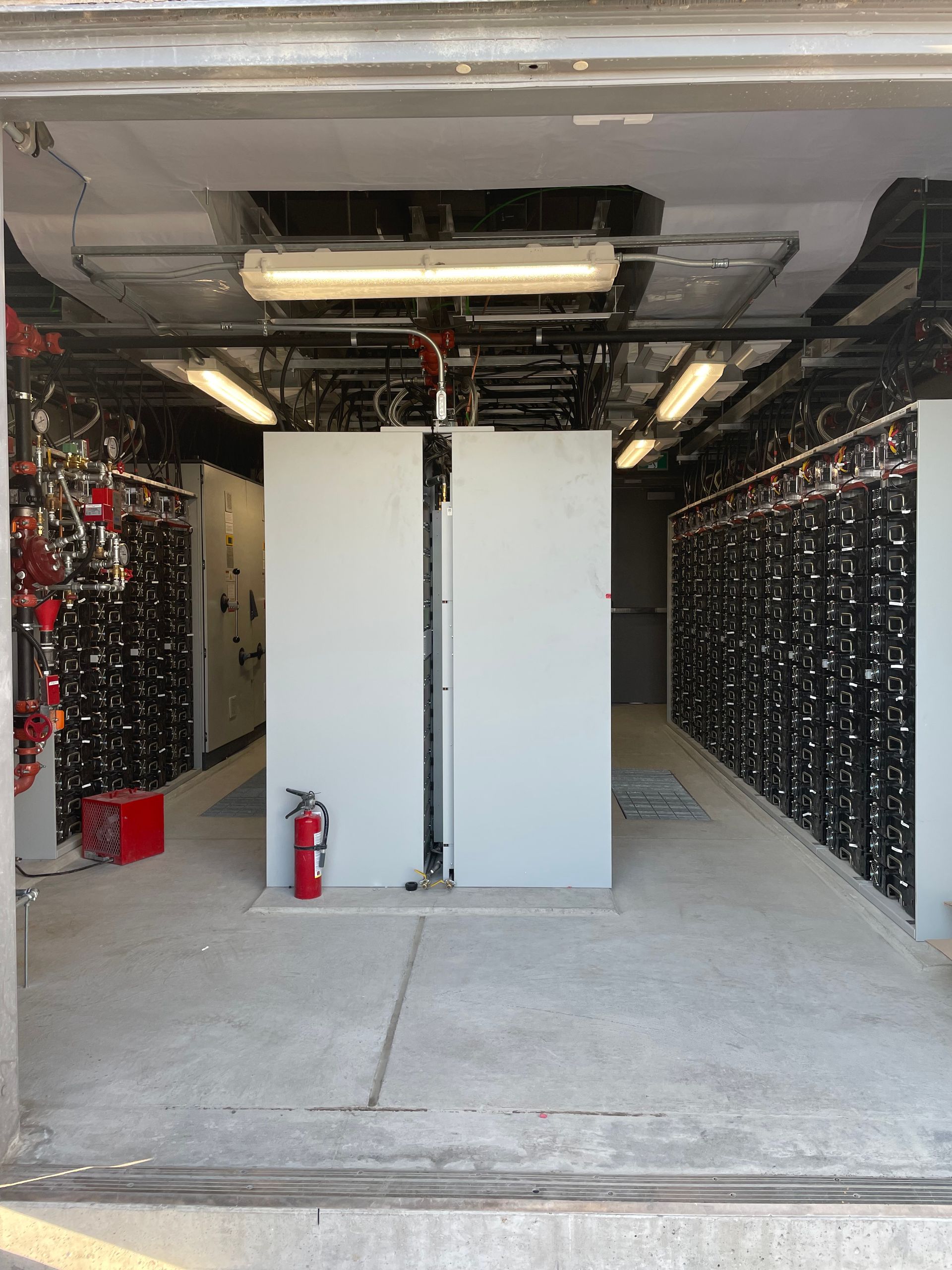 There is a fire extinguisher in the middle of the room.