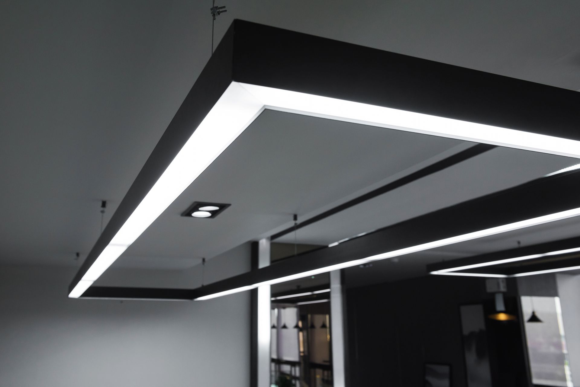 A ceiling with a lot of lights hanging from it
