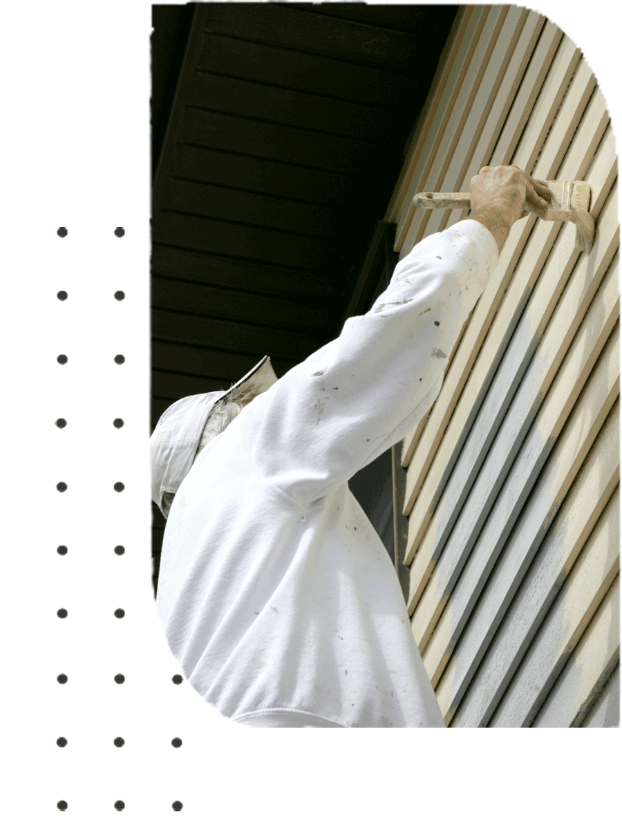 A man with a white shirt brushing a wall with paint | Sydney, NSW | Polypaint