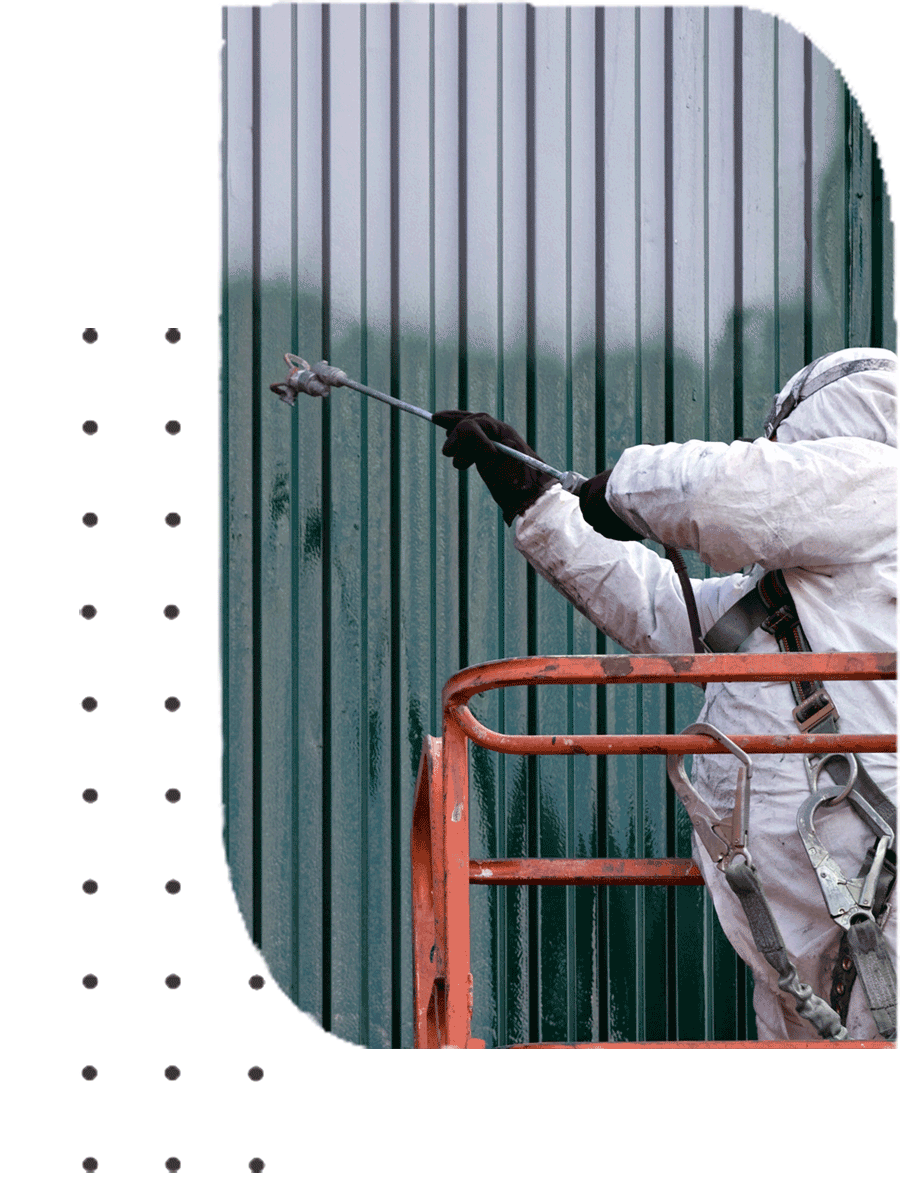 A person spraying a wall with green colour paint | Sydney, NSW | Polypaint