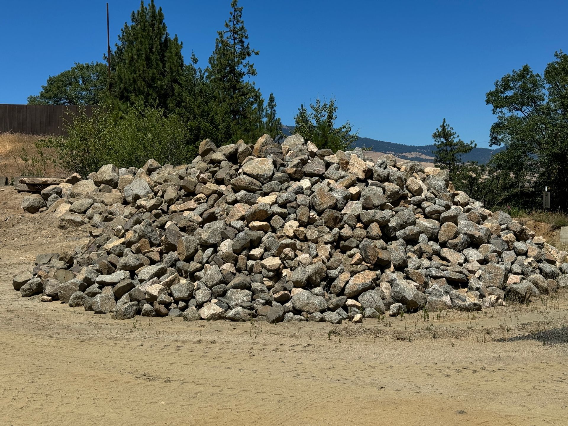 Hard stack granite for wall stacking in retaining walls or large french drains. 