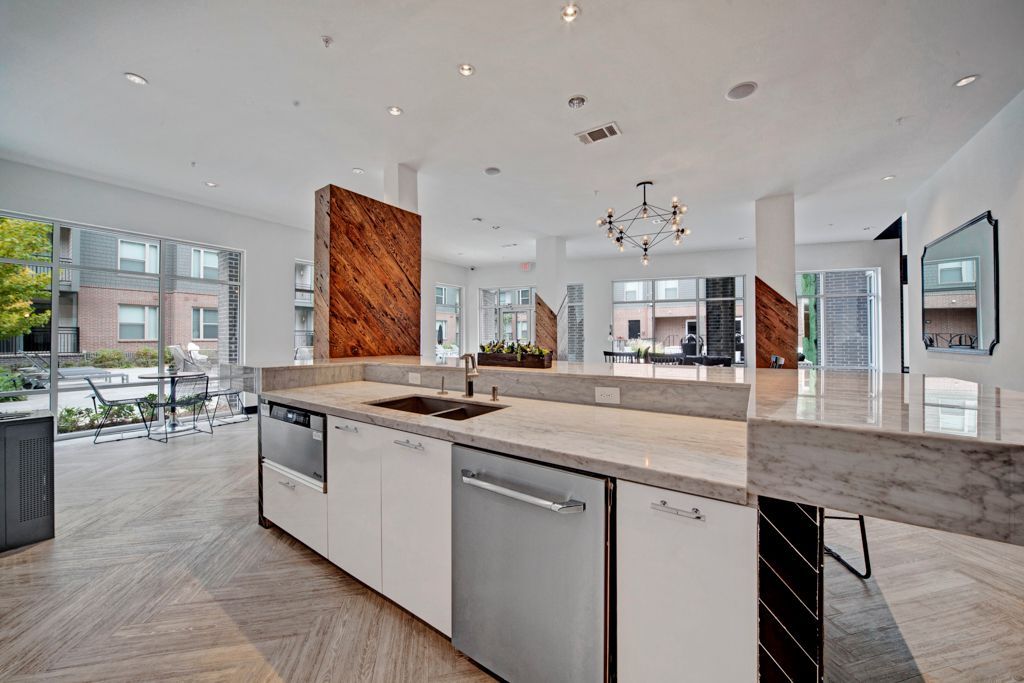 A large kitchen with a large island in the middle of the room.