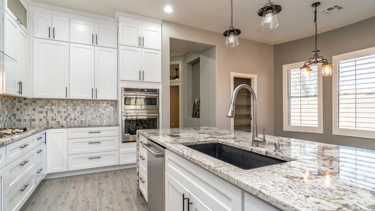 Beautiful kitchen remodel featuring modern cabinets, quartz countertops, and stylish sinks from Sherbi Stone.