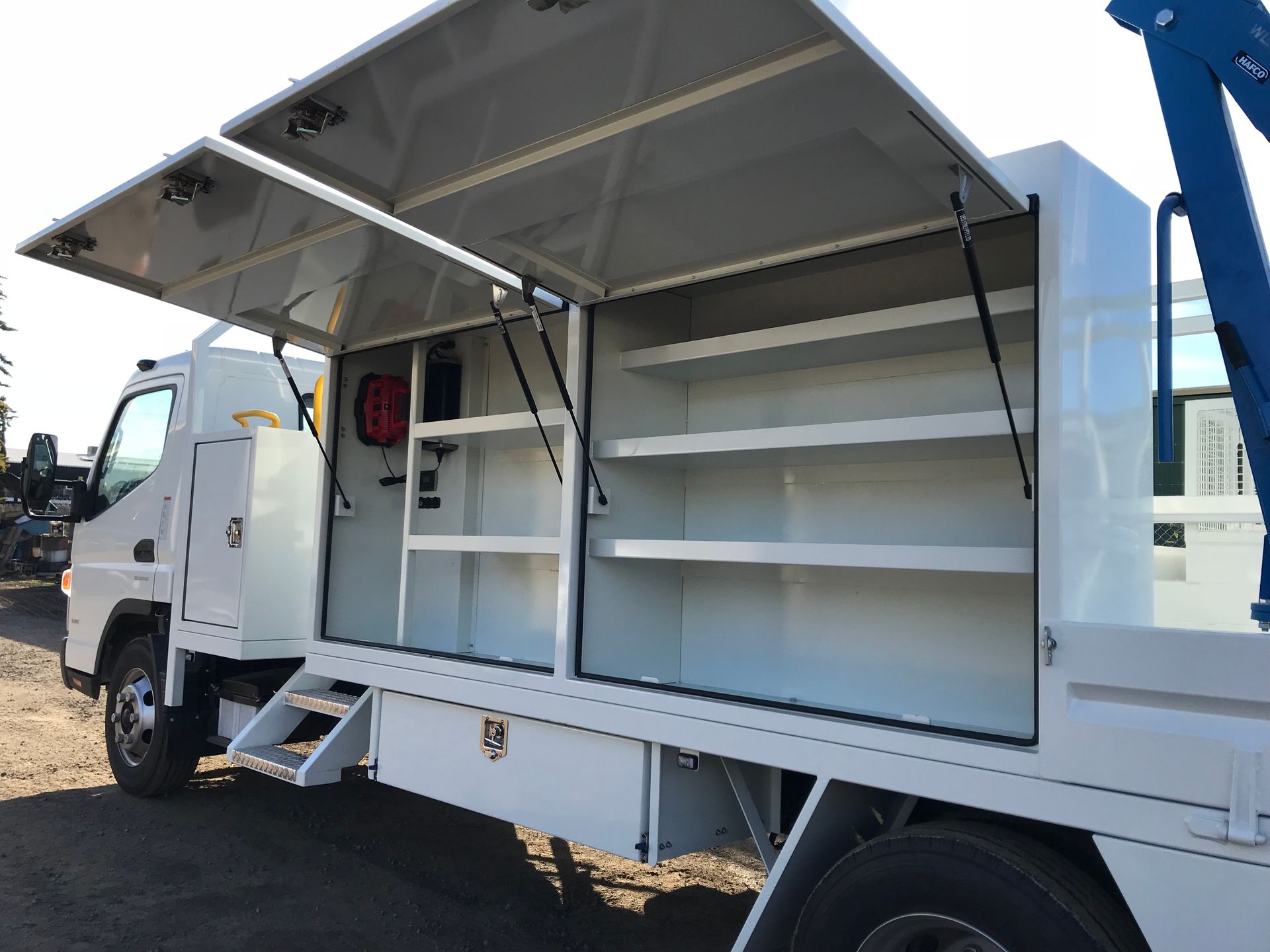 A white truck with the doors open and shelves — TMF Engineering In Benalla, VIC