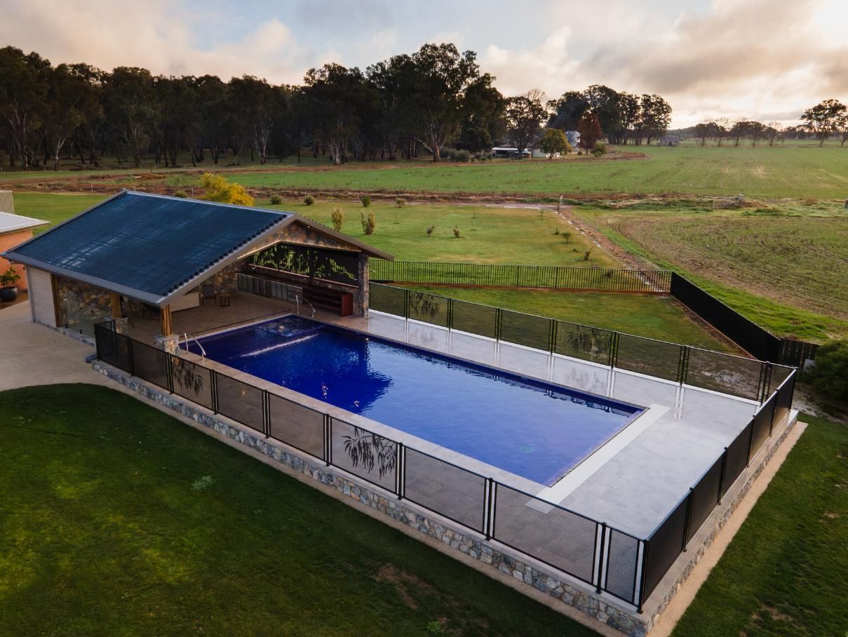 An Aerial View Of A Large Swimming Pool Surrounded By A Fence — TMF Engineering In Shepparton, VIC