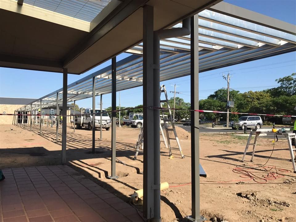 A Large Metal Structure Is Being Built On A Dirt Field — TMF Engineering In Shepparton, VIC