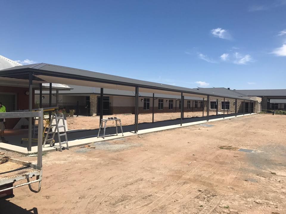 A large building with a covered walkway in front of it — TMF Engineering In Benalla, VIC