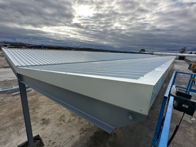 Shed With A Blue Crane Positioned On The Side — TMF Engineering In Cobram, VIC