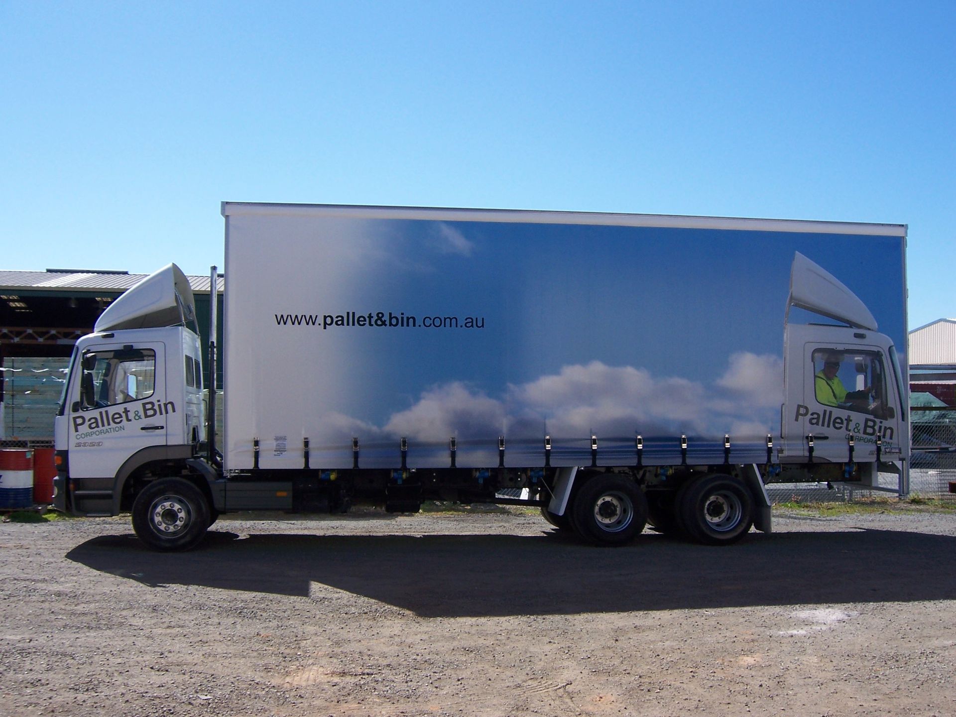A white truck with a blue sky and clouds on the side — TMF Engineering In Benalla, VIC