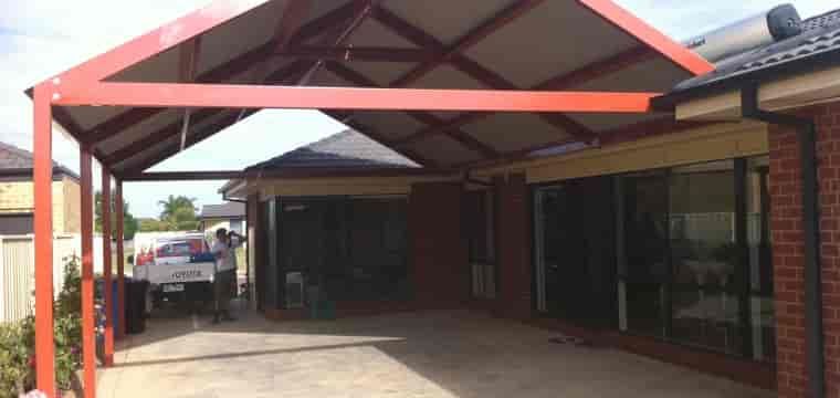A Car Is Parked Under A Canopy In Front Of A House — TMF Engineering In Numurkah, VIC
