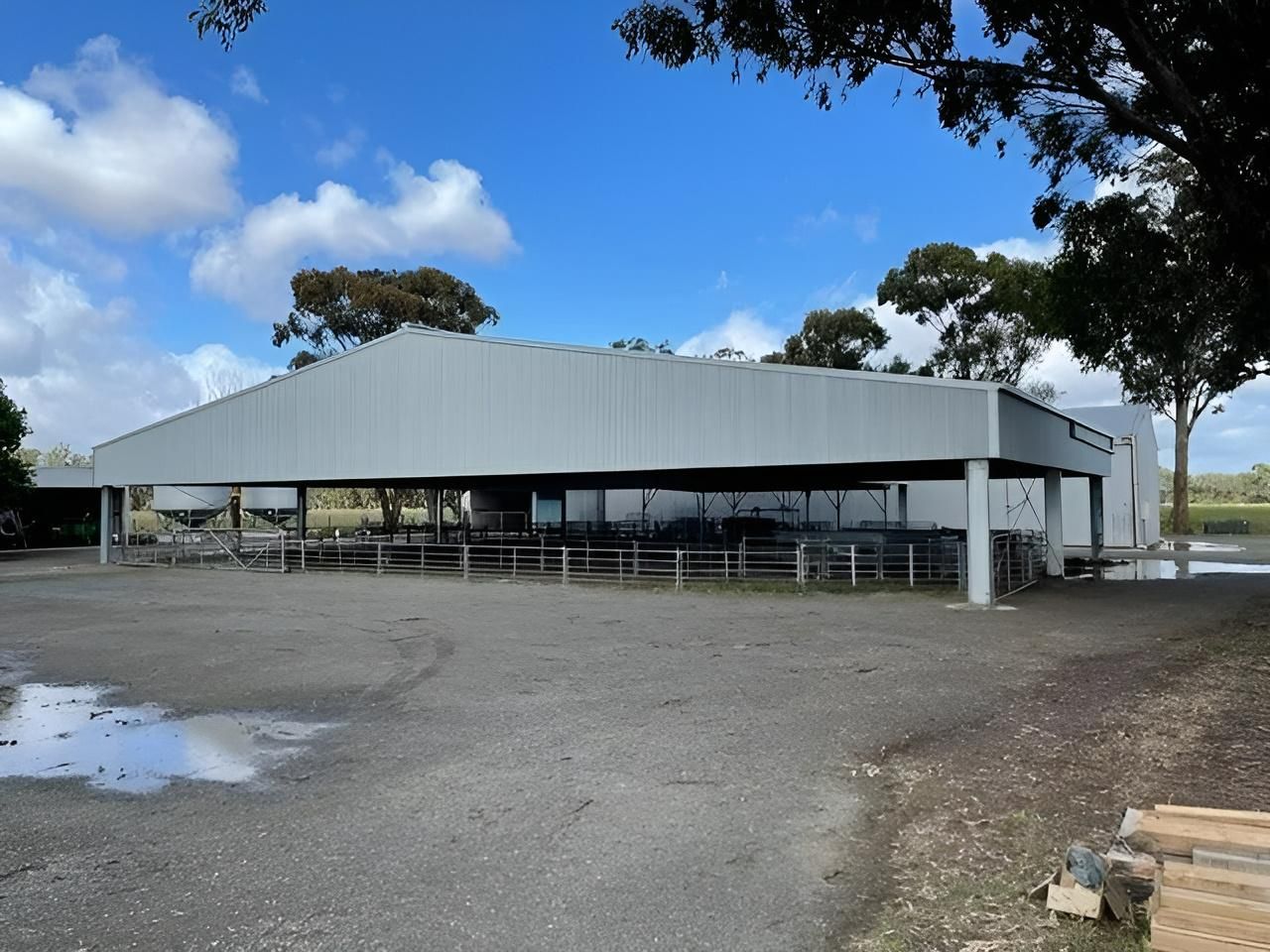 A Large Gray Building With A Blue Sky In The Background — TMF Engineering In Benalla, VIC