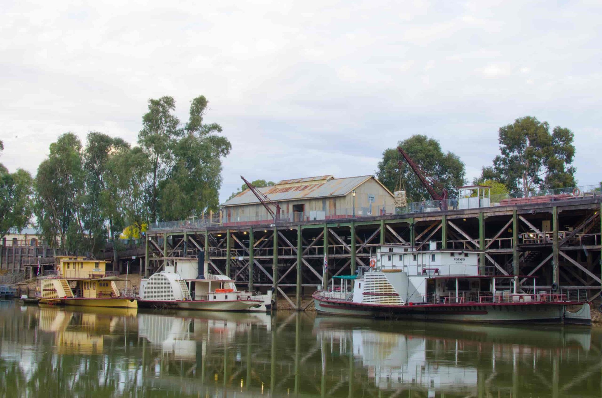 Three Boats Are Docked In A Harbor — TMF Engineering In Echuca, VIC