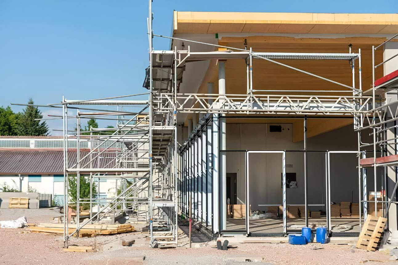 A Building Is Being Built With Scaffolding Around It — TMF Engineering In Shepparton, VIC