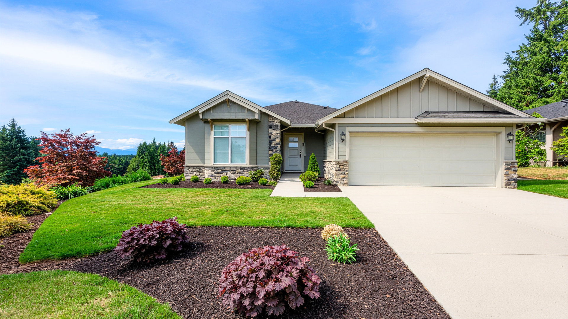New residential concrete driveway improving curb appeal and exterior appearance of a modern home.
