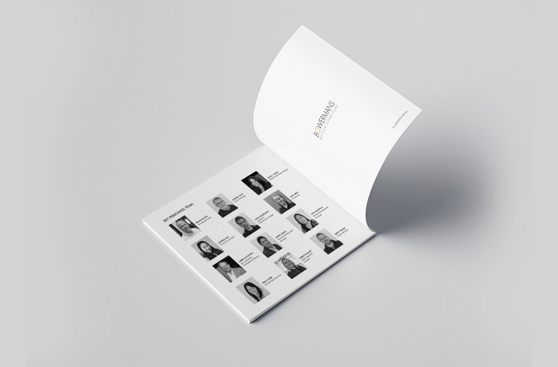 A book is open to a page with a list of people on it.