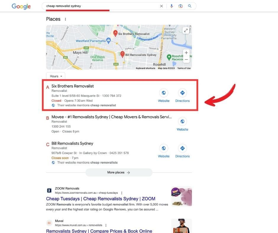 A google search page with a red arrow pointing to a location.