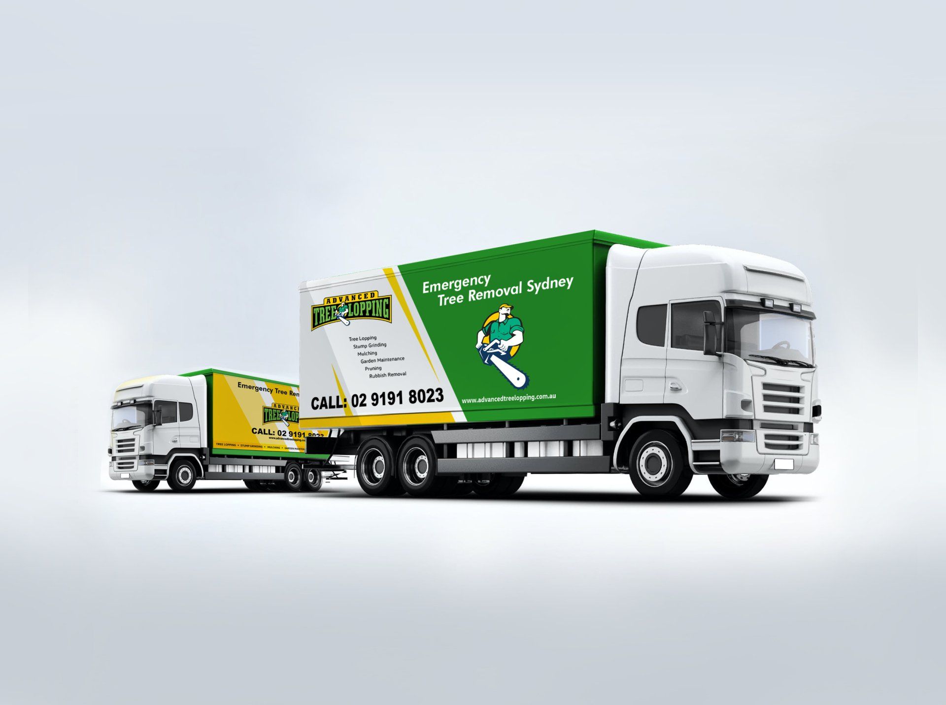 Two trucks are parked next to each other on a white surface.