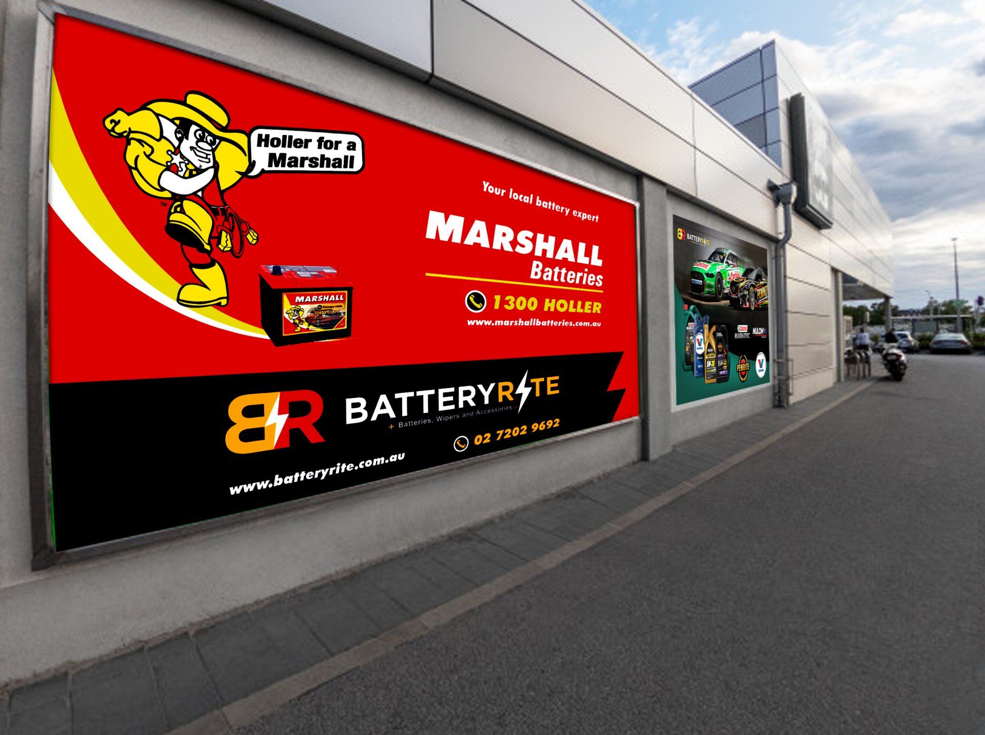 An advertisement for marshall batteries hangs on the side of a building