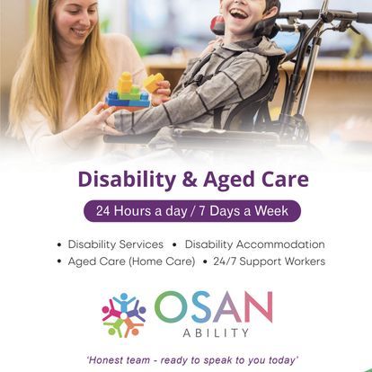 A woman is playing with a child in a wheelchair.