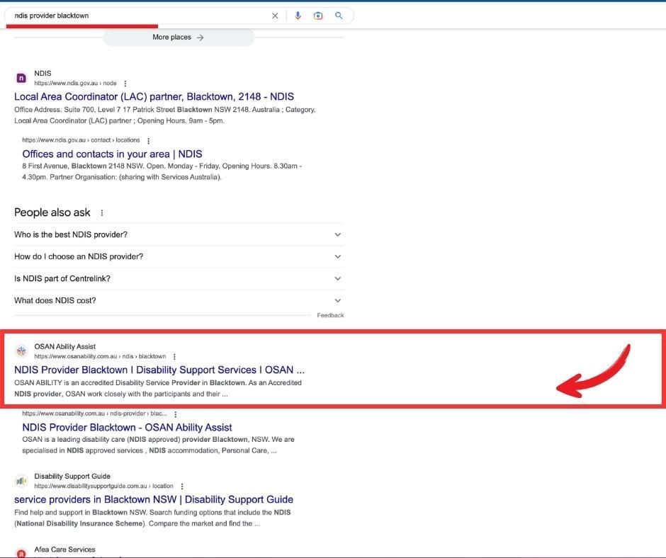 A screenshot of a google search page with a red arrow pointing to the top of the page.