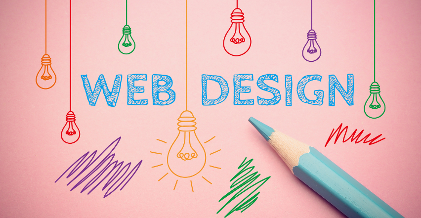 The word web design is written on a pink paper with a pencil.