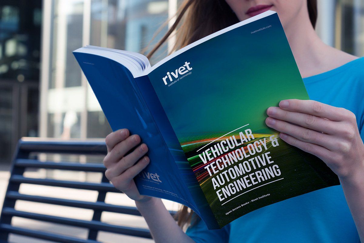 A woman is reading a book about vehicle technology and automotive engineering