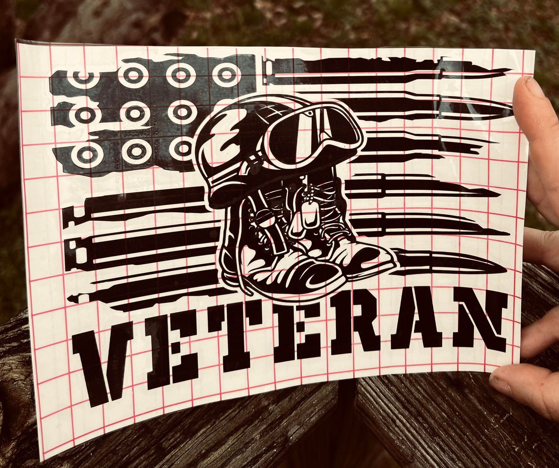 American flag design with boots and helmet; the word 