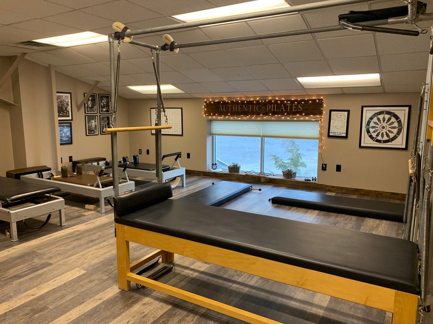 There is a pilates machine in the middle of the room.