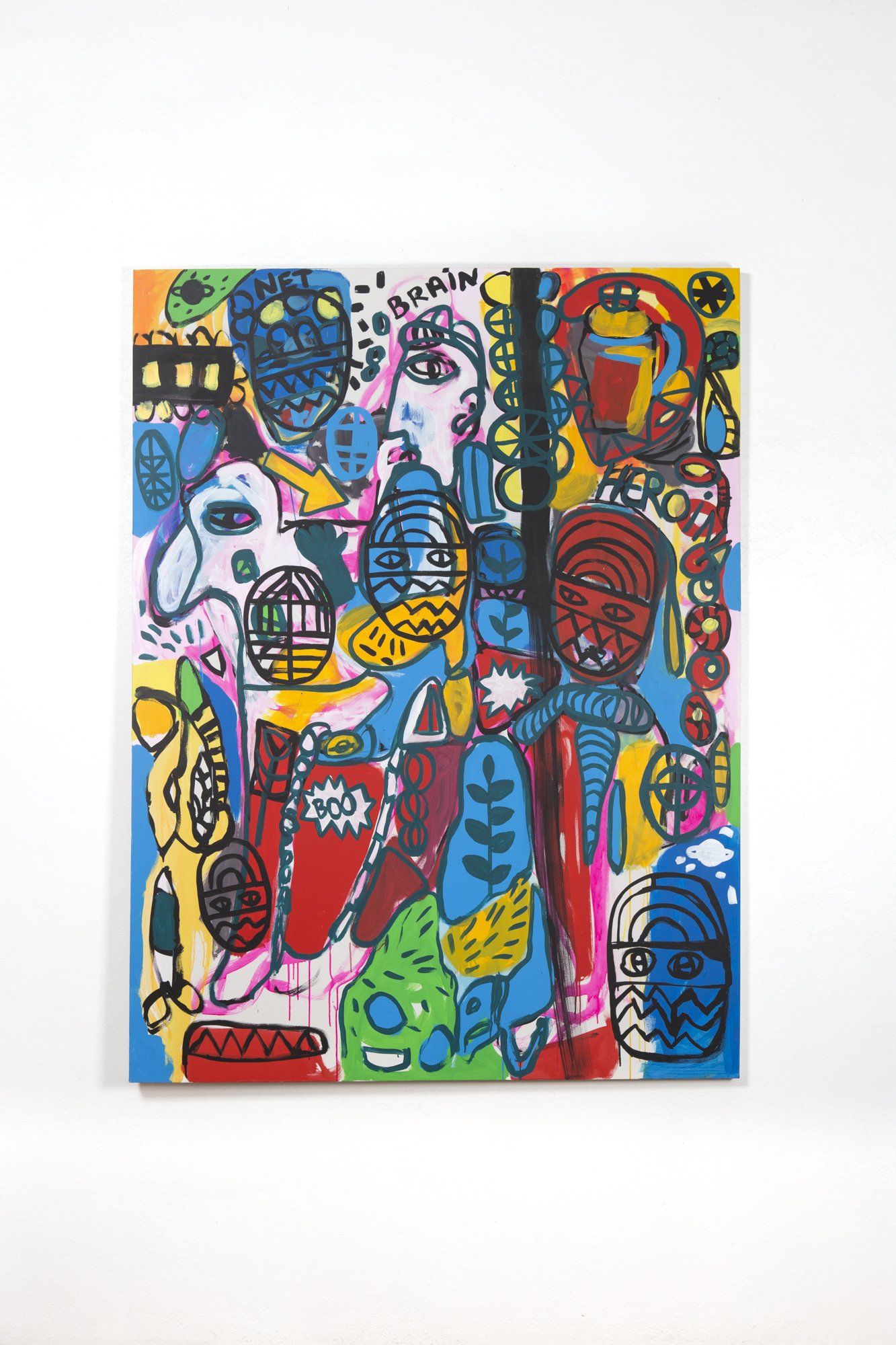 A colorful painting is hanging on a white wall.