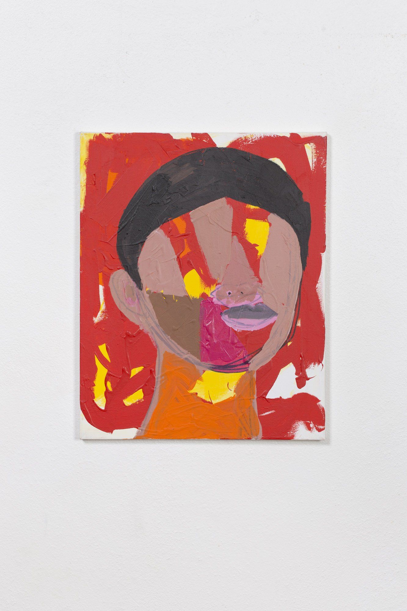 A colorful painting of a person 's face on a white wall.