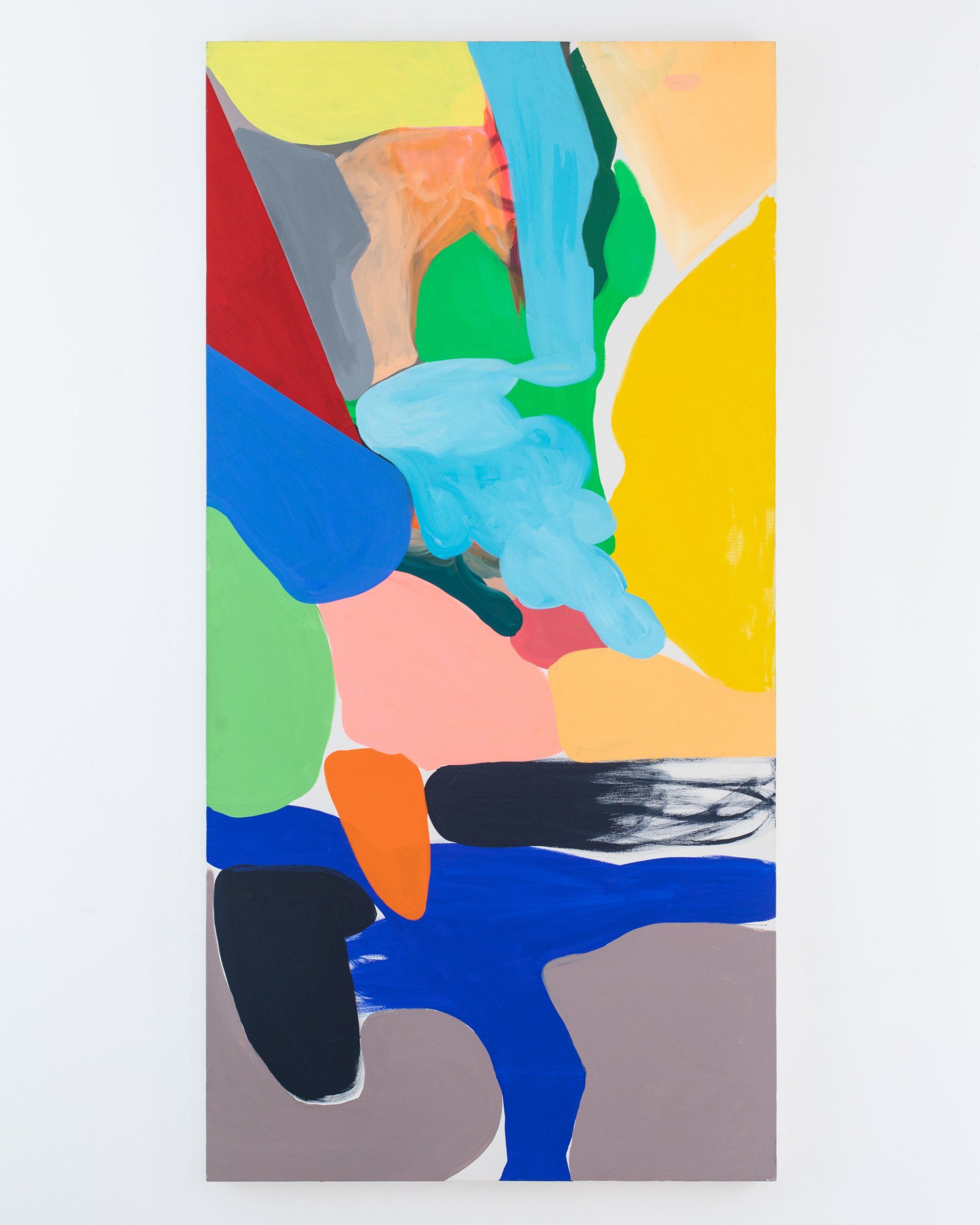 A colorful painting is hanging on a white wall