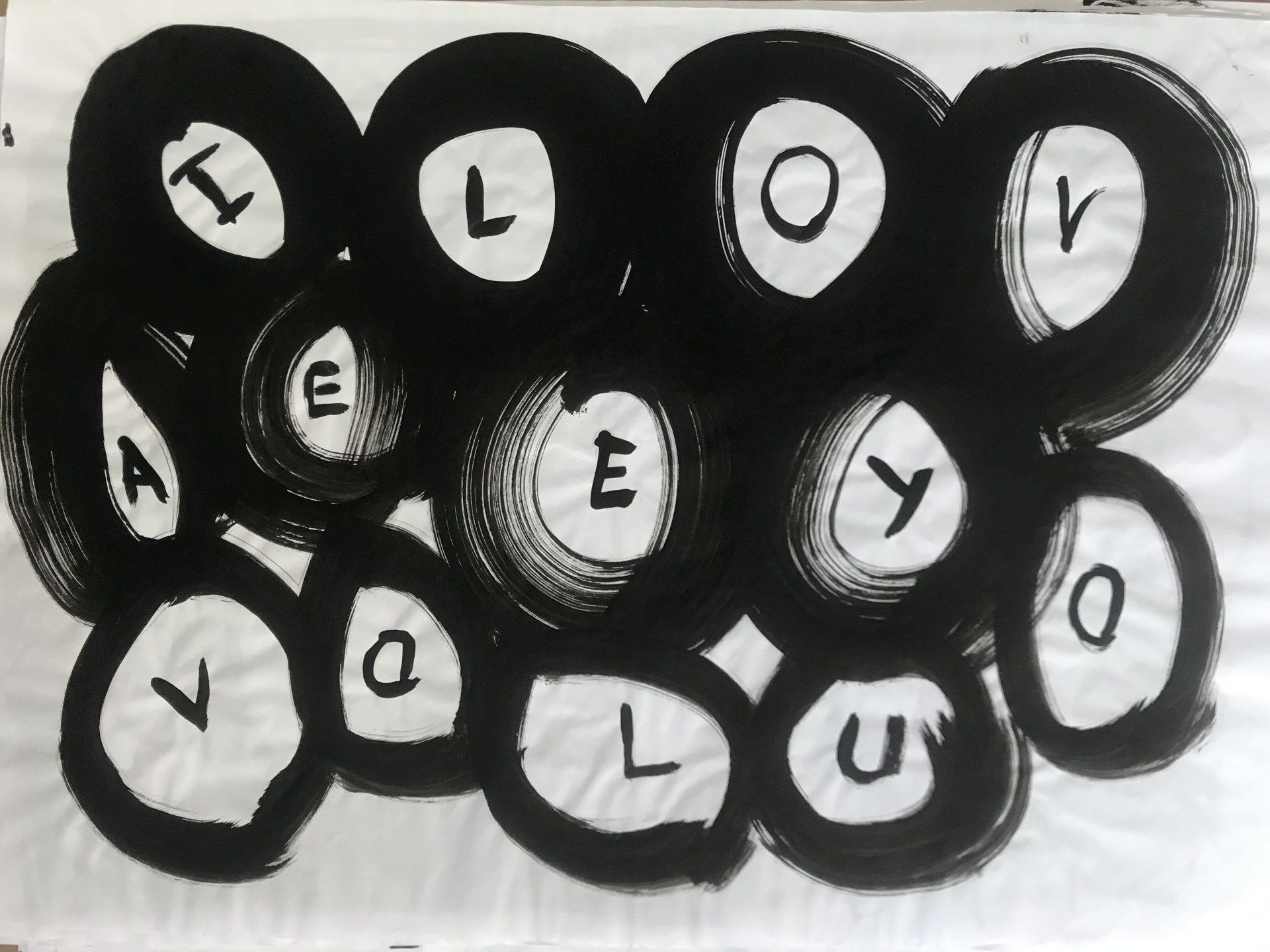 A bunch of black circles with white letters on them